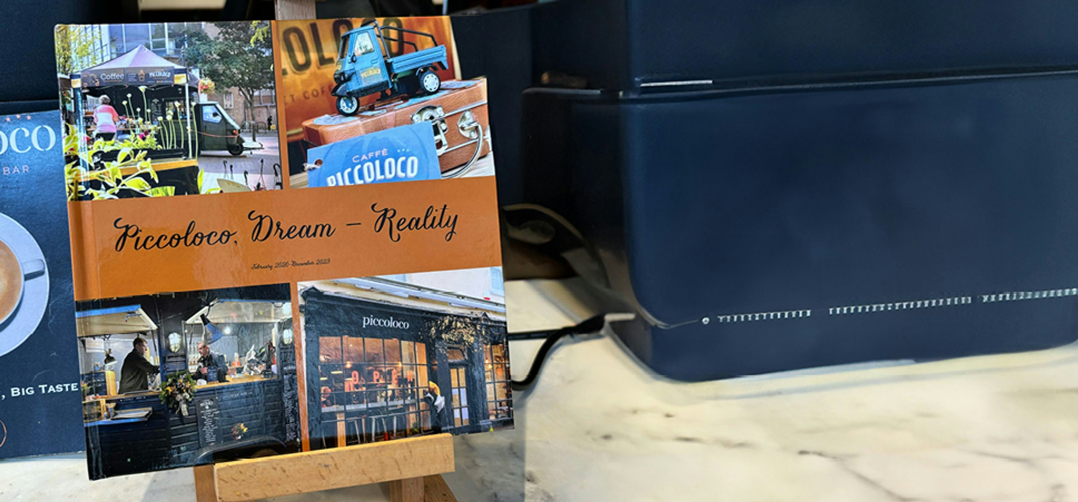 Book on small stand which shows the journey of Piccoloco - "Dream to reality"