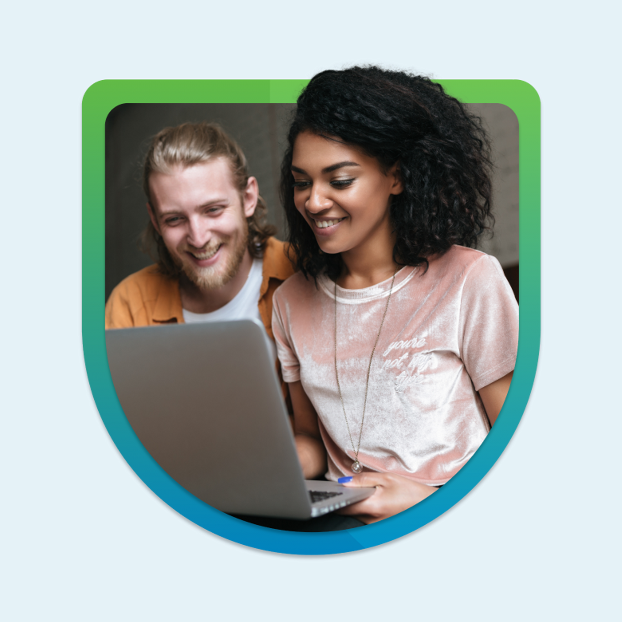 Young man and woman smiling and looking at a laptop within a circular frame with blue and green borders on a blue background.