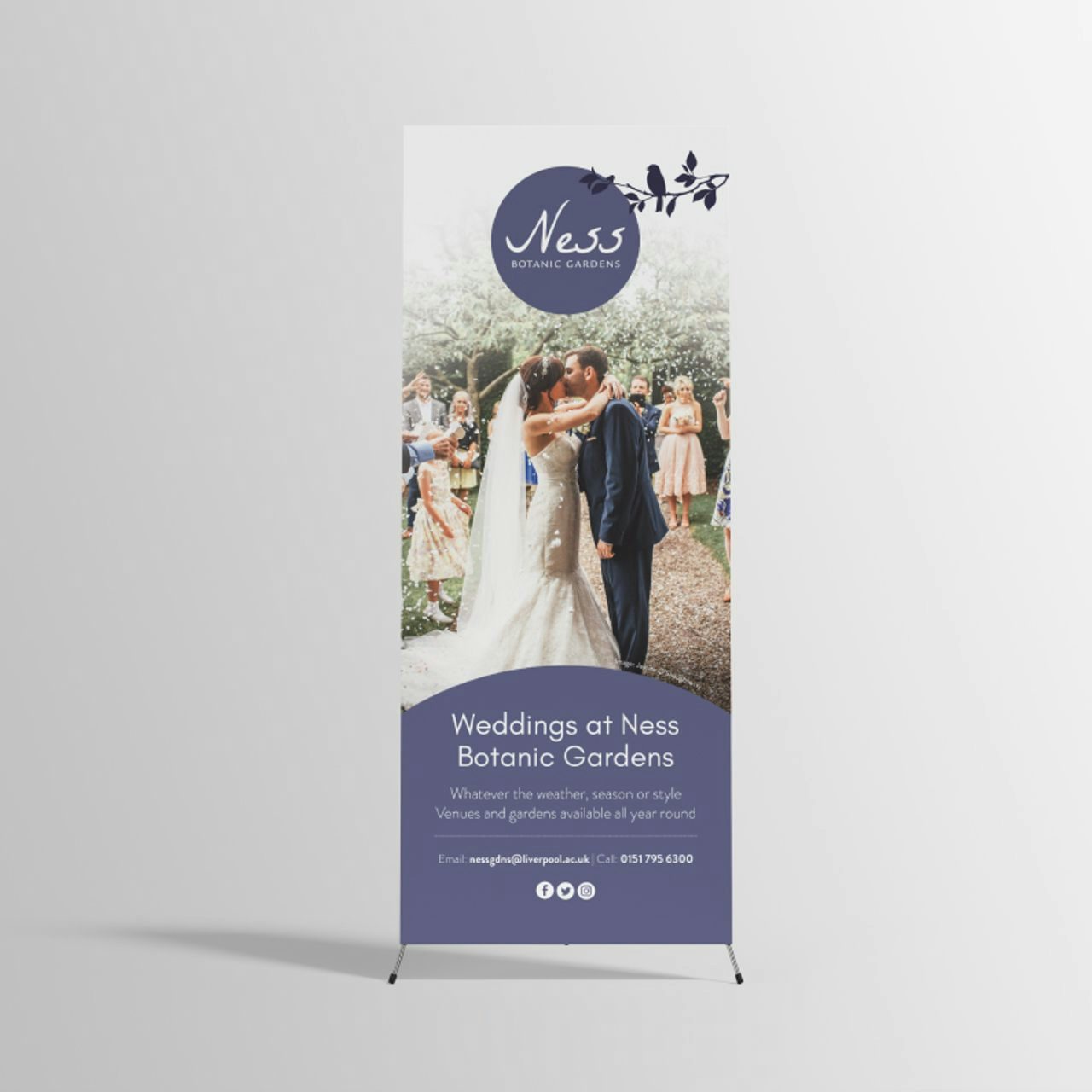 Promotional roll-up banner for Ness Botanic Gardens featuring a bride and groom, on a white background.
